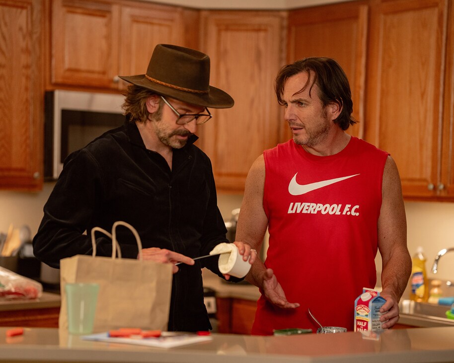 Bradley Cooper and Will Arnett in IS THIS THING ON? Photo by Searchlight Pictures/Jason McDonald, Courtesy of Searchlight Pictures. © 2025 Searchlight Pictures All Rights Reserved.