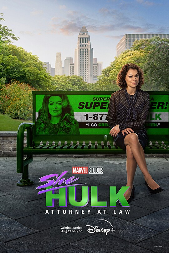 Jennifer Walters (played by Tatiana Maslany) sits on a New York park bench in business attire and her legs crossed, looking towards the camera. The bench advertisement has an image of Jessica as She-Hulk and is entirely in green.