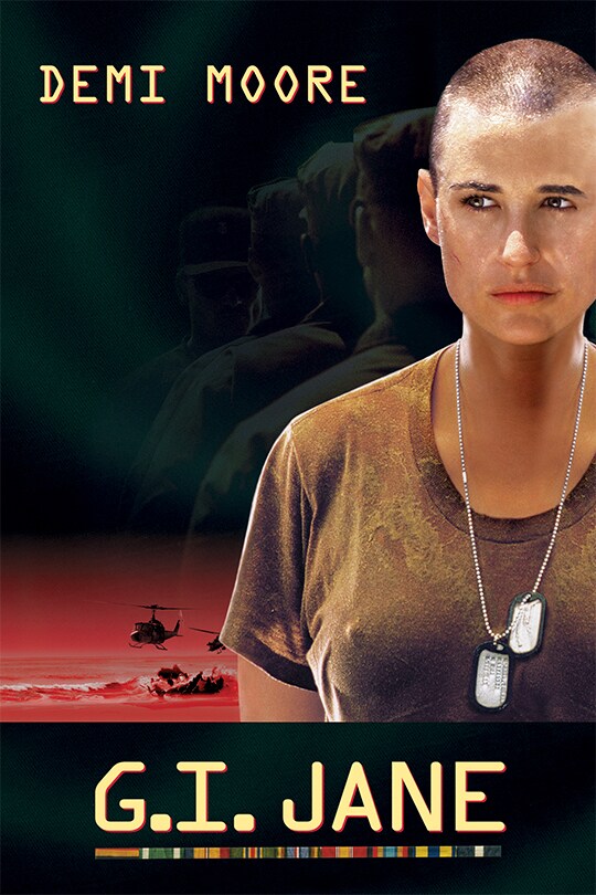 Demi Moore appears on the cover as G.I. Jane, wtih shaved head, dark coloured shirt and dog tags. The background is dark, with some silhouetted small helicopters towards the bottom of the image.