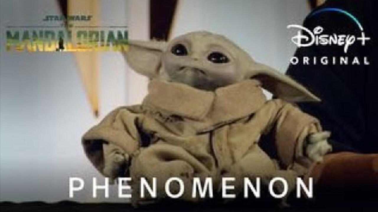 An image The Child from series The Mandalorian, with text 'Phenomenon' featuring in the foreground of the image, 'The Mandalorian' title treatment in the top left hand corner and 'Disney+ Original' in the top right hand.