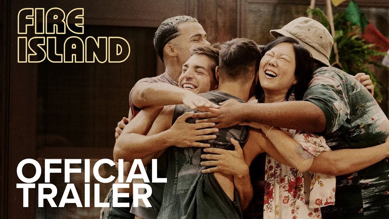 A group of friends in 'Fire Island' group hug, smiling. The 'Fire Island' title treatment in the top left hand of the image, and 'Official Trailer' text in the bottom left of the image.