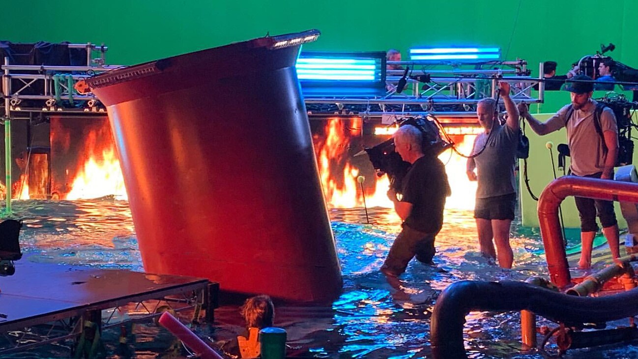 James Cameron in tank with water/fire and 3D camera