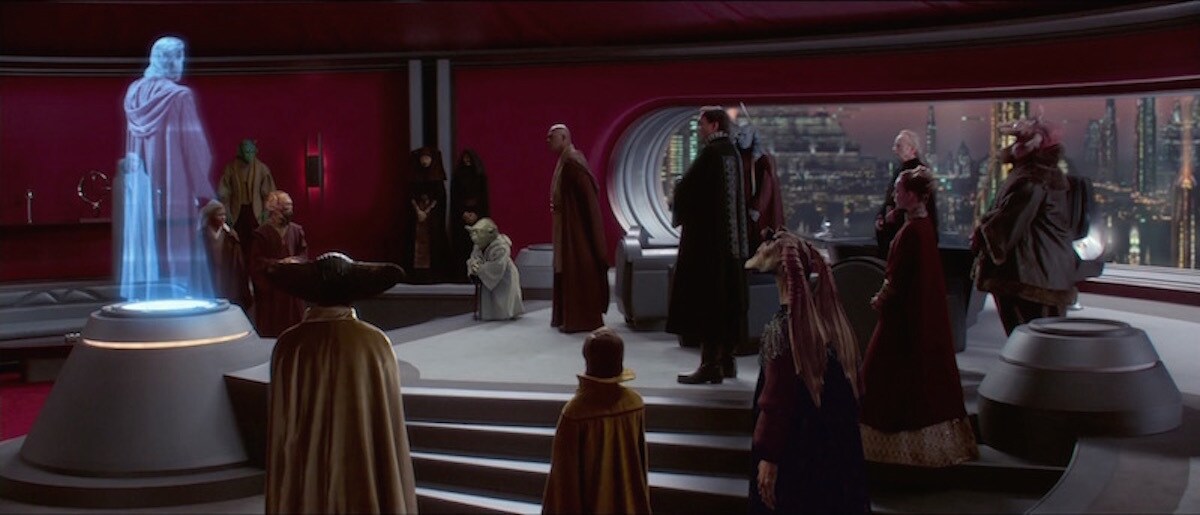 Bail Organa, prominent Senators, and Jedi Masters watching a transmission from Obi-Wan Kenobi