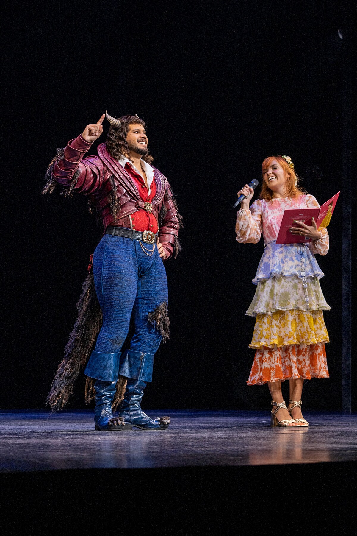 Chloe Hayden on stage with 'Beast' from Disney's Beauty and the Beast the musical.