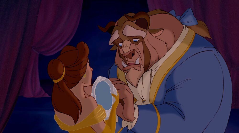 Beast gives Belle a mirror in the movie "Beauty and the Beast"