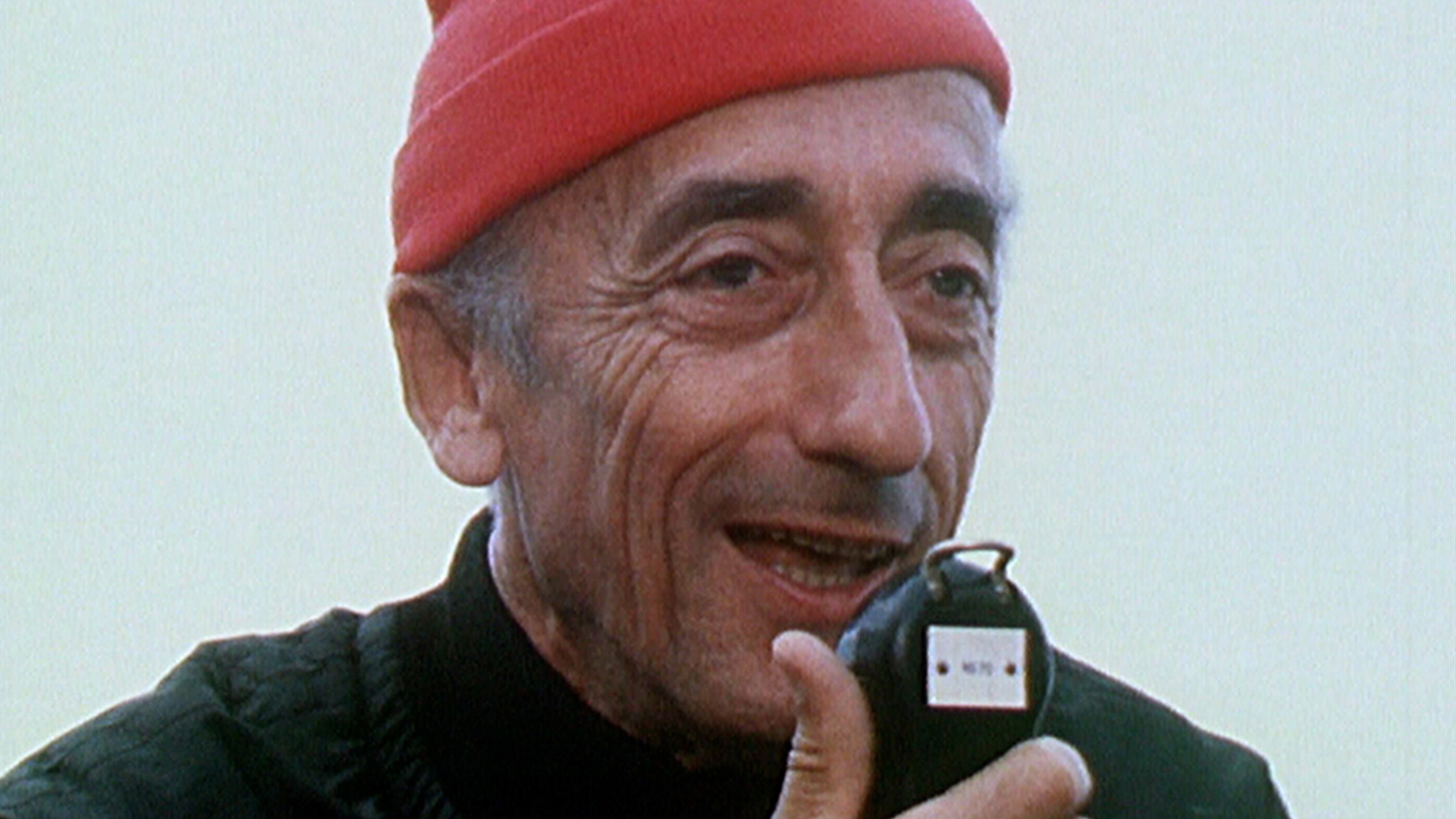July 1969: Jacques Cousteau communicates by radio with a crew member exploring the ocean depths in one of the Calypso's diving saucers. (Credit: The Cousteau Society)