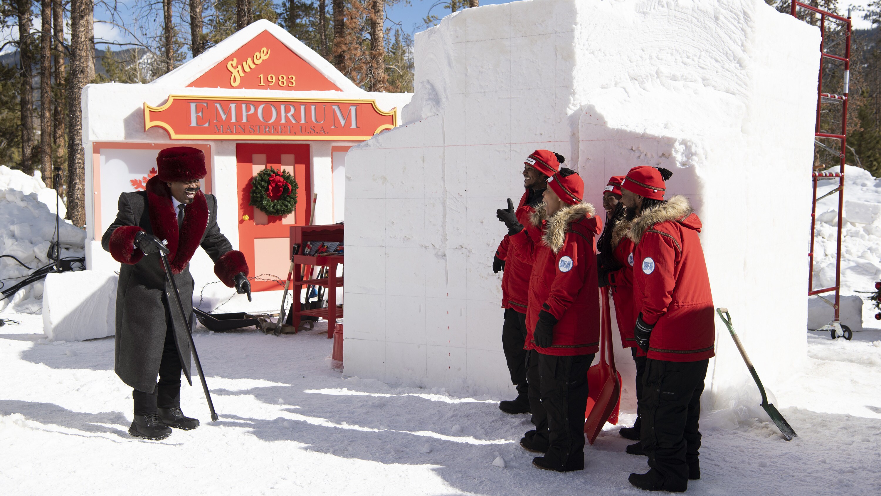 BEST IN SNOW. Host, Tituss Burgess, speaks to the carving team, Hakuna Matata/Southern Snow. (Disney/Todd Wawrychuk)
