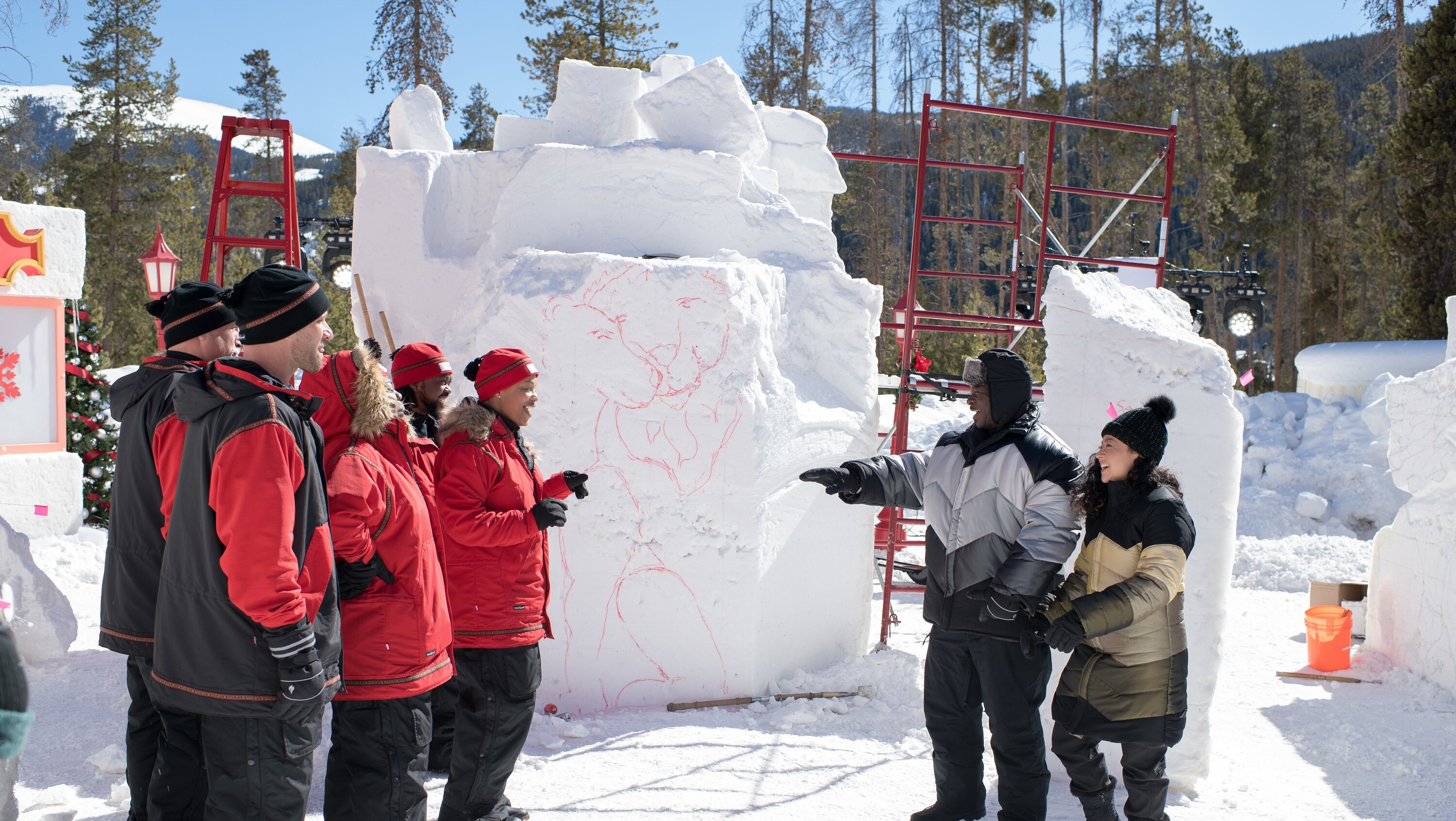 BEST IN SNOW. Judges Andre Rush and Sue McGrew speak with Team Hakuna Matata/Southern Snow. (Disney/Todd Wawrychuk)