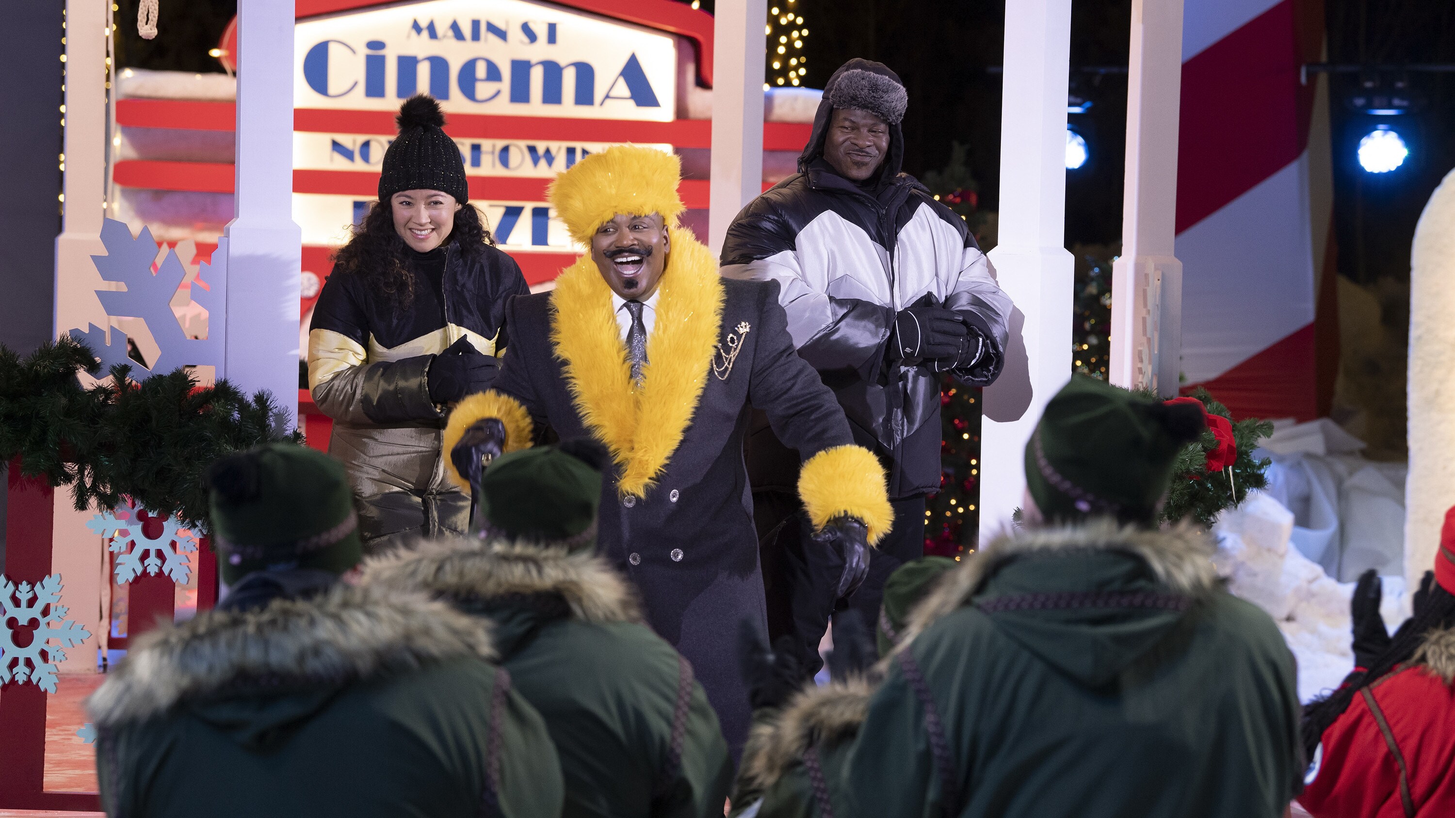 BEST IN SNOW. Host, Tituss Burgess (center), and judges, Sue McGrew and Andre Rush. (Disney/Todd Wawrychuk)
