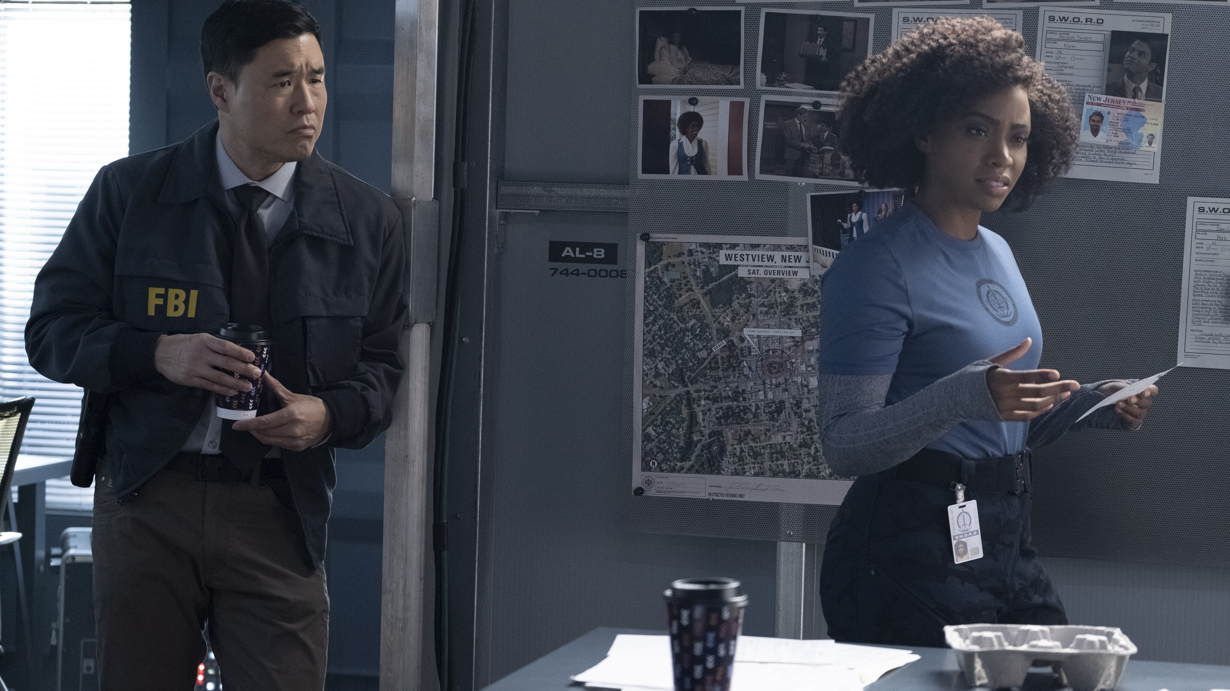 (L-R): Randall Park as Jimmy Woo and Teyonah Parris as Monica Rambeau in Marvel Studios' WANDAVISION exclusively on Disney+. Photo by Chuck Zlotnick. ©Marvel Studios 2021. All Rights Reserved.