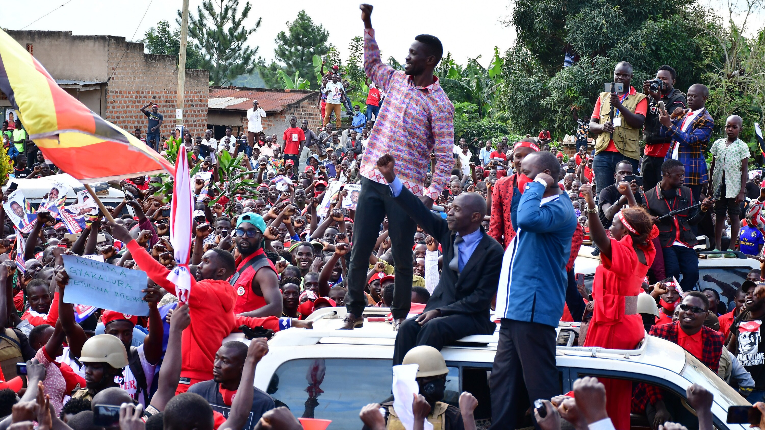 Bobi Wine on top of his vehicle during the 2021 presidential campaigns as he solicited for support in Nakaseke, Central Uganda on November 18, 2020. (photo credit: Lookman Kampala)