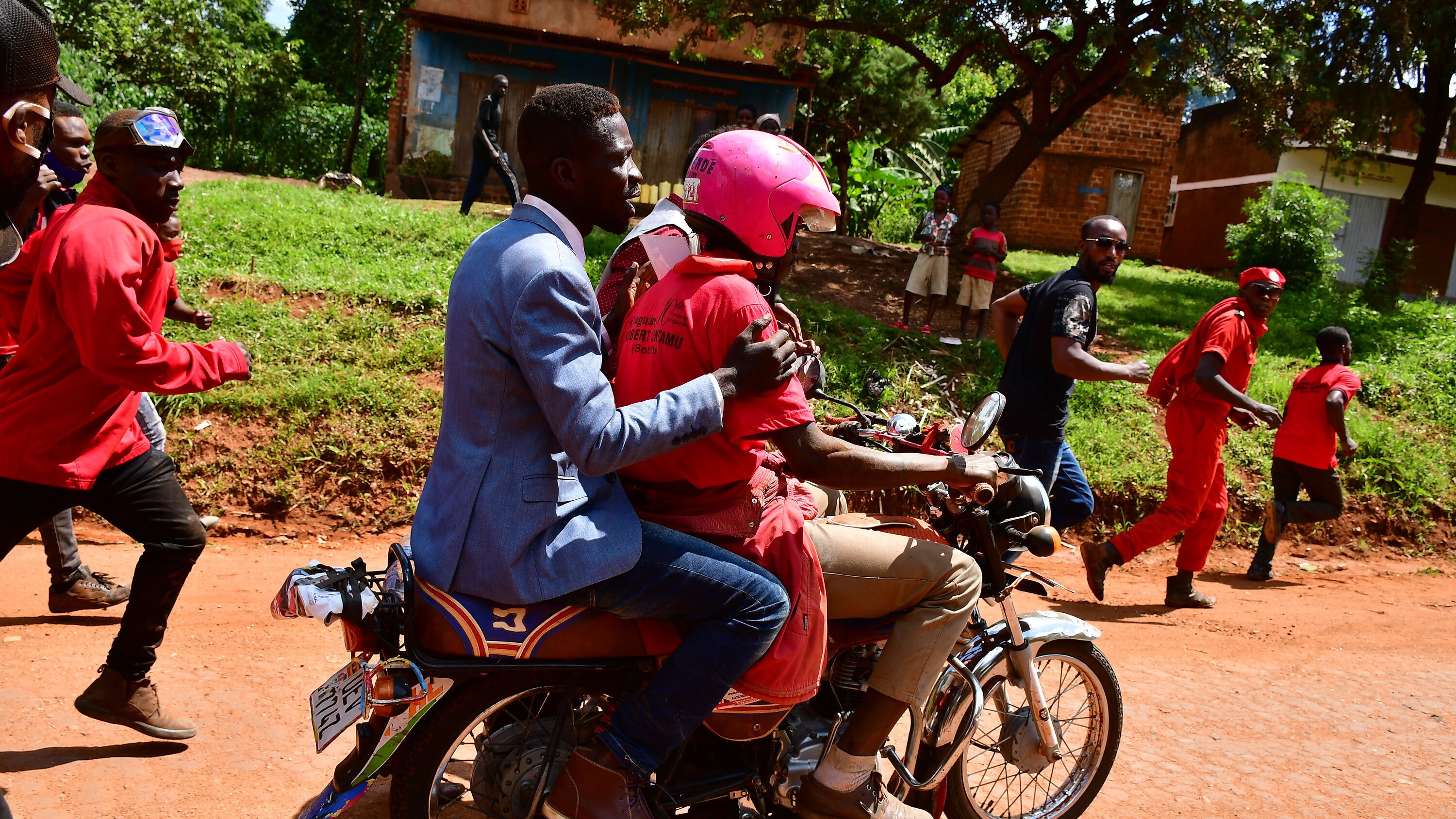 Bobi Wine decides to travel to a campaign location in Kayunga District by motorbike. The Ugandan security vehicles had previously prevented his cars from entering the venue on December 1, 2020. (photo credit: Lookman Kampala)