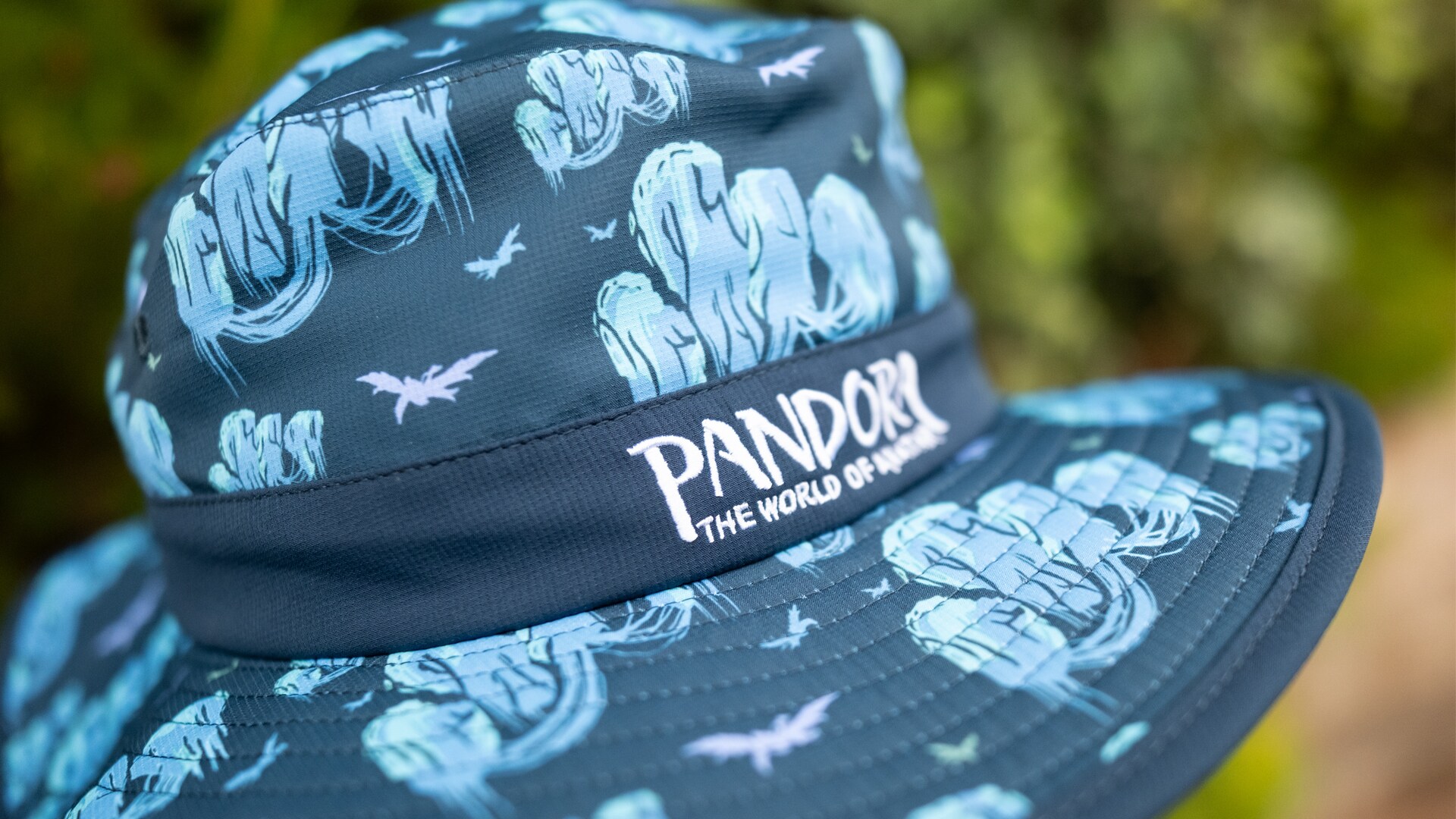 Floating Mountains Bucket Hat Floating Mountains Bucket Hat - Featuring Pandora's iconic floating mountains and banshees, this bucket hat offers double the magic—beautiful detail by day, glowing wonder by night.
