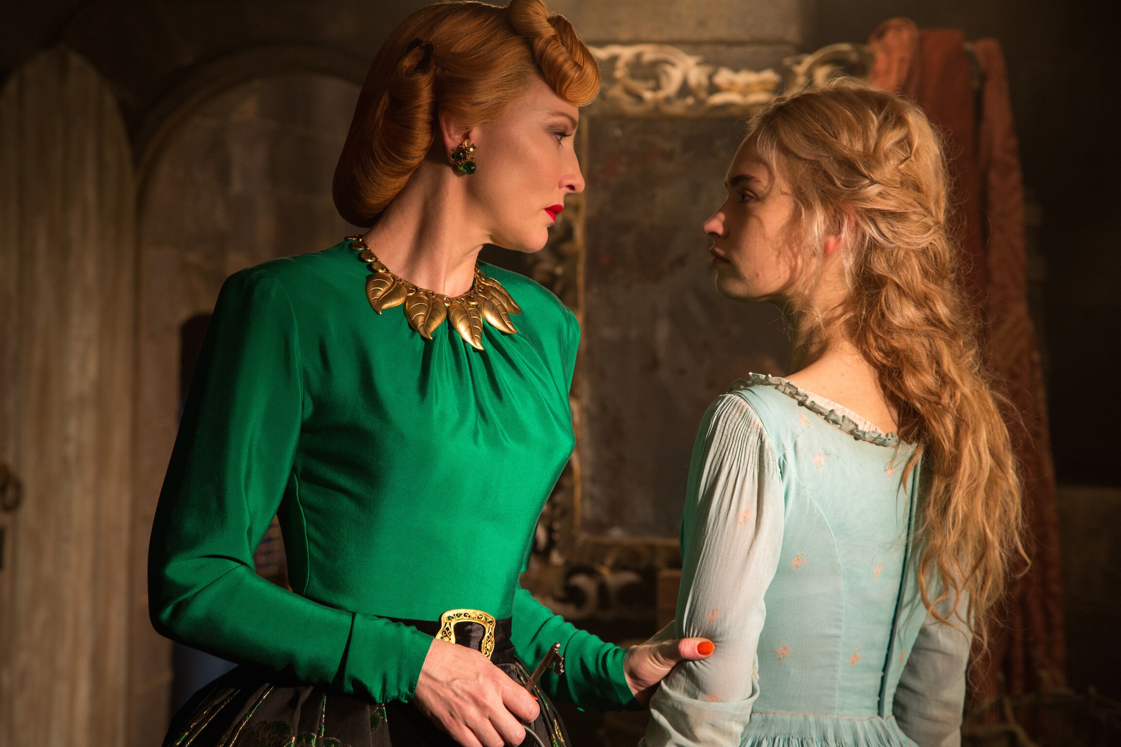 Actors Cate Blanchett (as the Stepmother) and Lily James (as Cinderella) in the movie Cinderella.