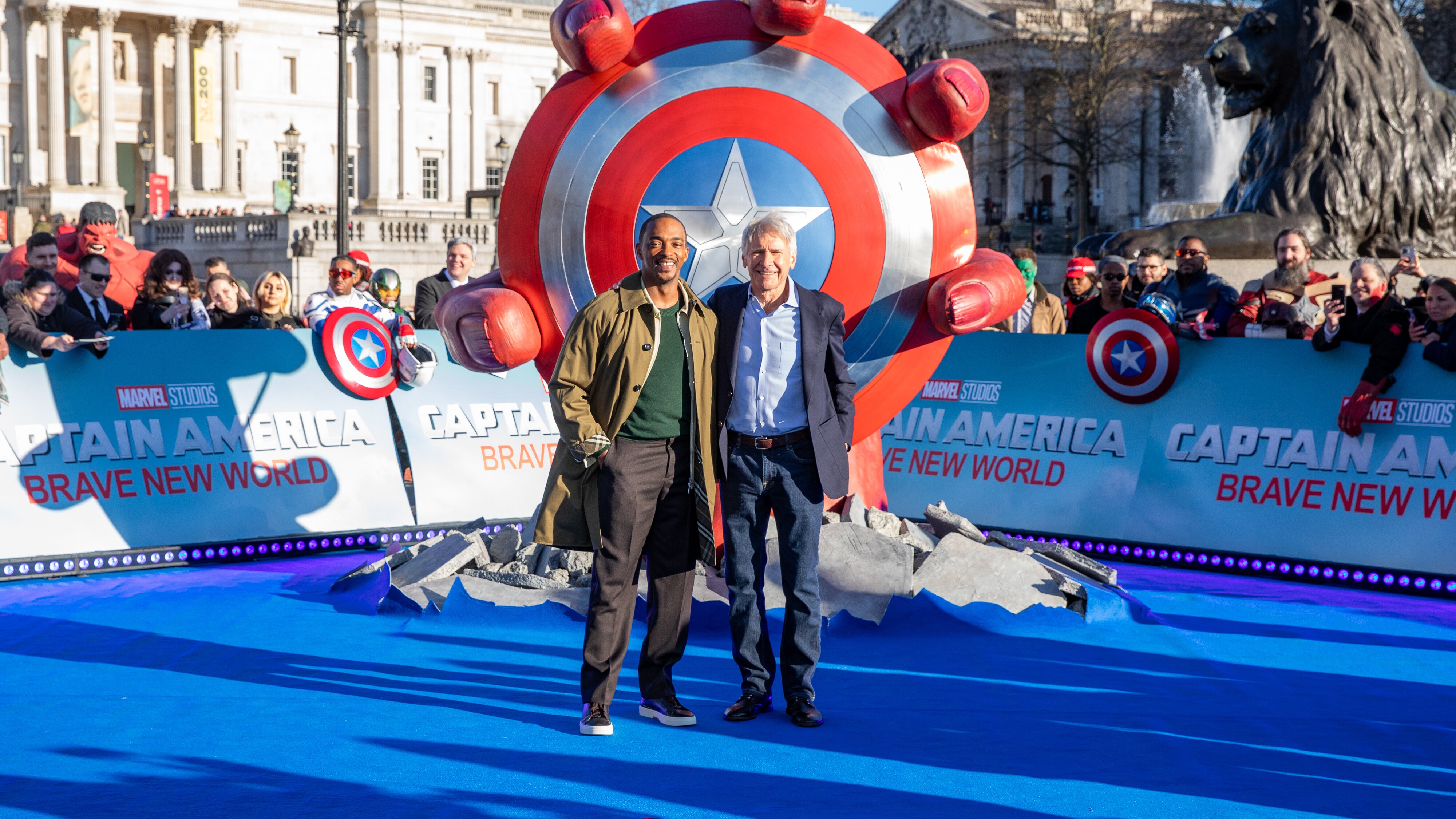 MARVEL STUDIOS’ CAPTAIN AMERICA: BRAVE NEW WORLD’S RED HULK SMASHES THROUGH TRAFALGAR SQUARE WITH CAP’S SHIELD IN HAND