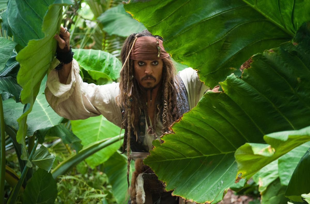 Actor Johnny Depp as Captain Jack Sparrow in a jungle from the movie "Pirates of the Caribbean"