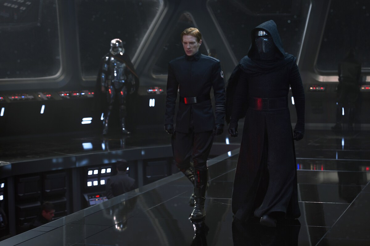 Captain Phasma standing in a command bridge as Kylo Ren and General Hux strategize Captain Phasma standing in a command bridge as Kylo Ren and General Hux strategize