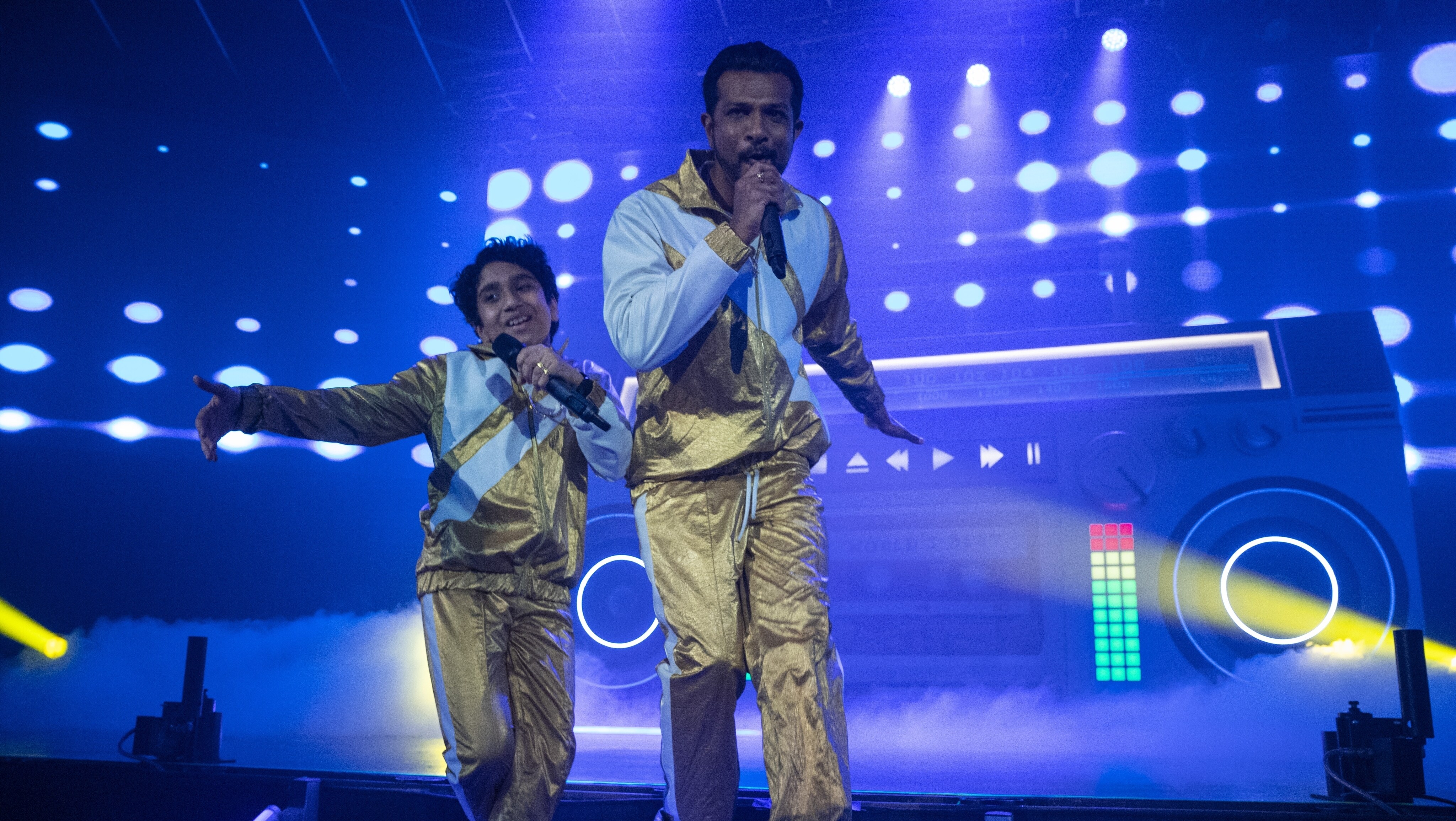 (L-R): Manny Magnus as Prem and Utkarsh Ambudkar as Suresh in WORLD'S BEST, exclusively on Disney+. Photo by Ben Mark Holzberg. © 2023 Disney Enterprises, Inc. All Rights Reserved.