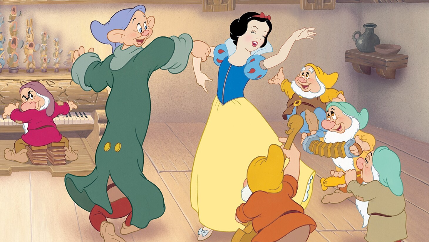 Snow White dances with the Seven Dwarfs