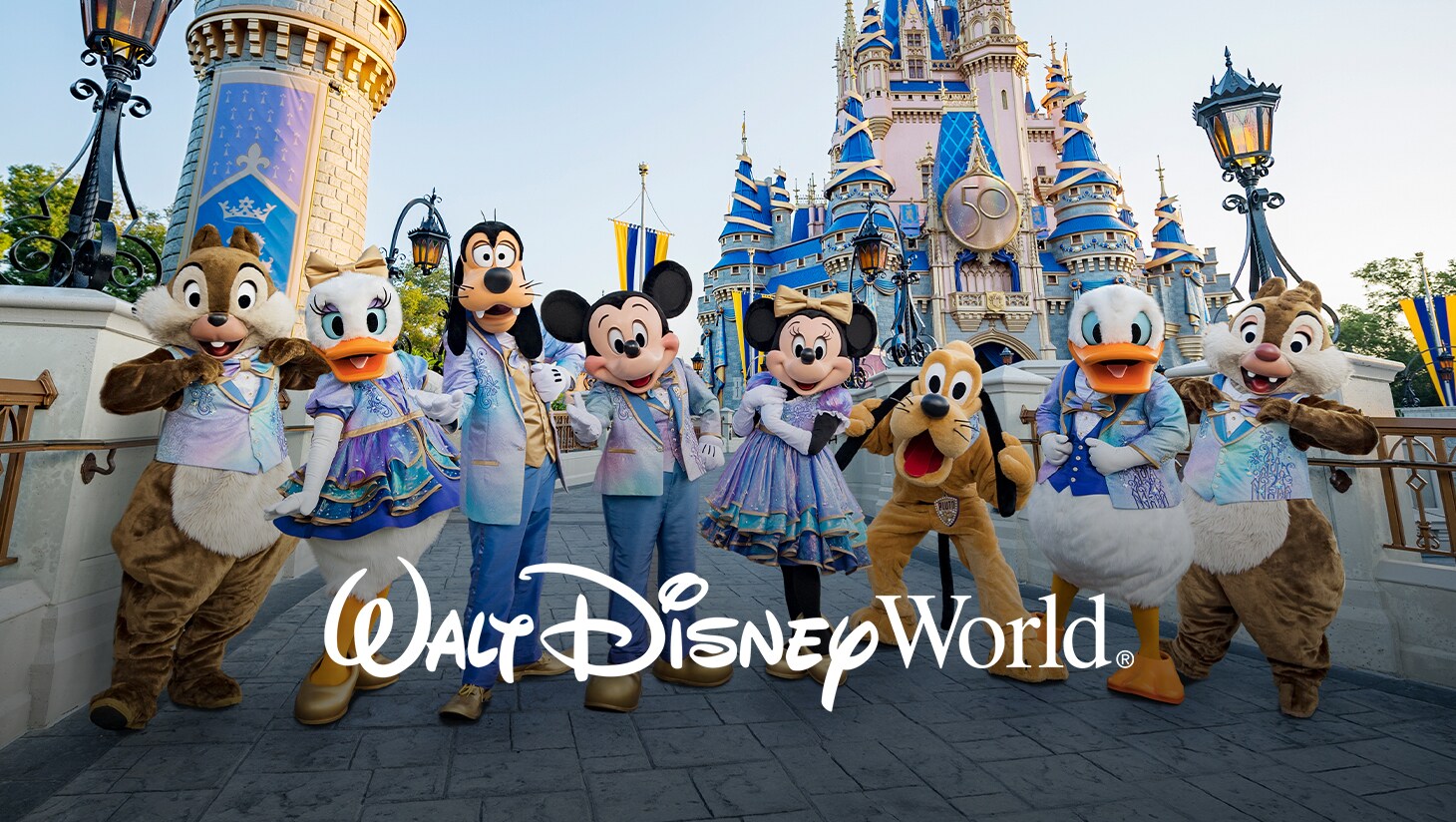 Chip, Daisy, Goofy, Mickey Mouse, Minnie Mouse, Pluto, Donald, and Dale pose in front of Cinderella Castle at Walt Disney World