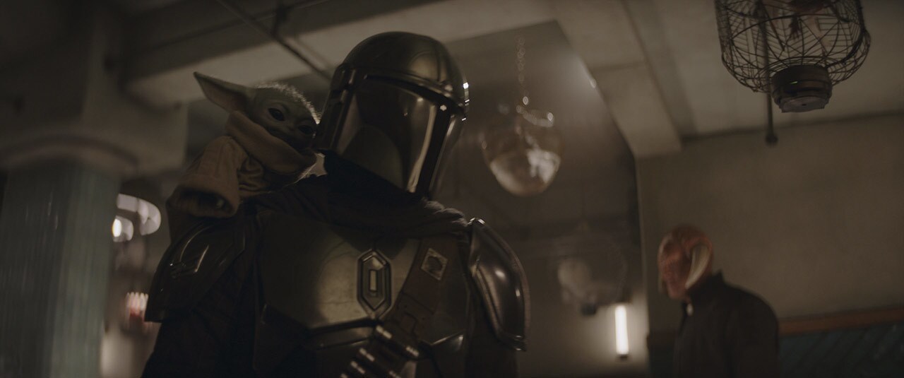 Grogu and Din Djarin in Star Wars: The Mandalorian and Grogu.
