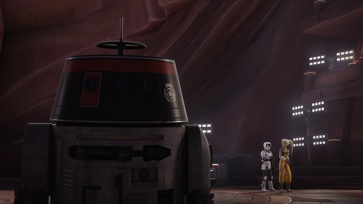 A disguised Chopper watching as Hera Syndulla and a disguised Ezra Bridger sneak into the compound A disguised Chopper watching as Hera Syndulla and a disguised Ezra Bridger sneak into the compound
