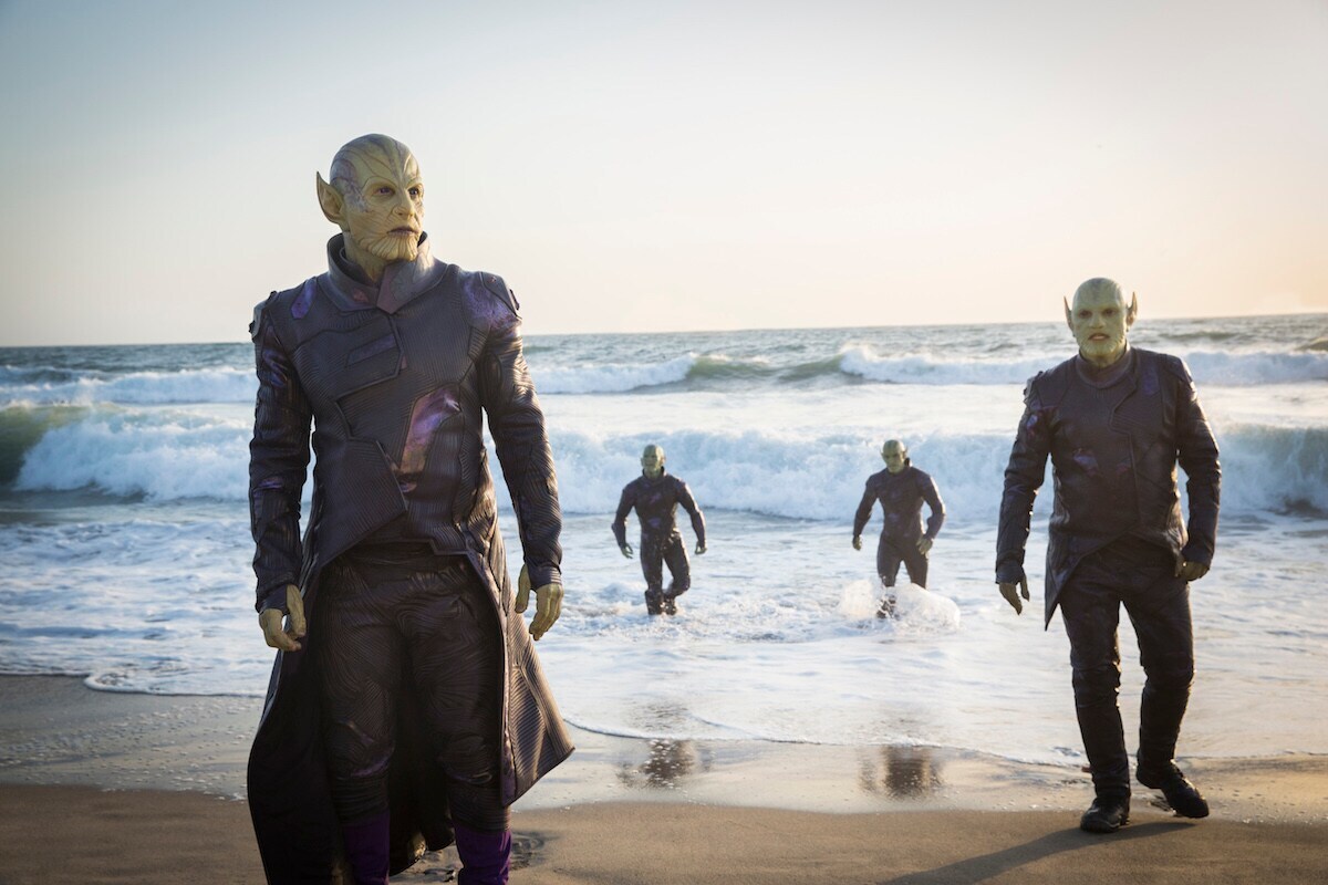 Green Skrull aliens emerging from a beach