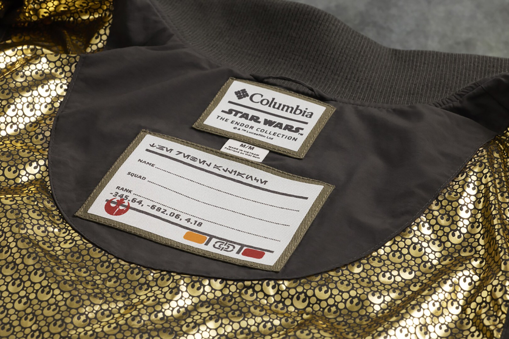 The badge detail and coat lining in the General Han Solo Trench coat from Columbia's Endor-Inspired Star Wars Collection.