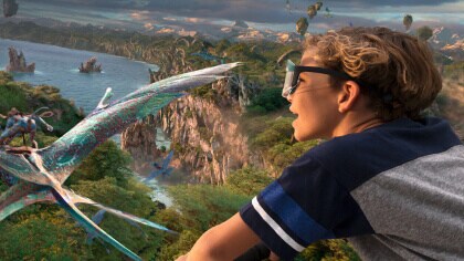 Kid wearing goggles while on Avatar Flight of Passage 