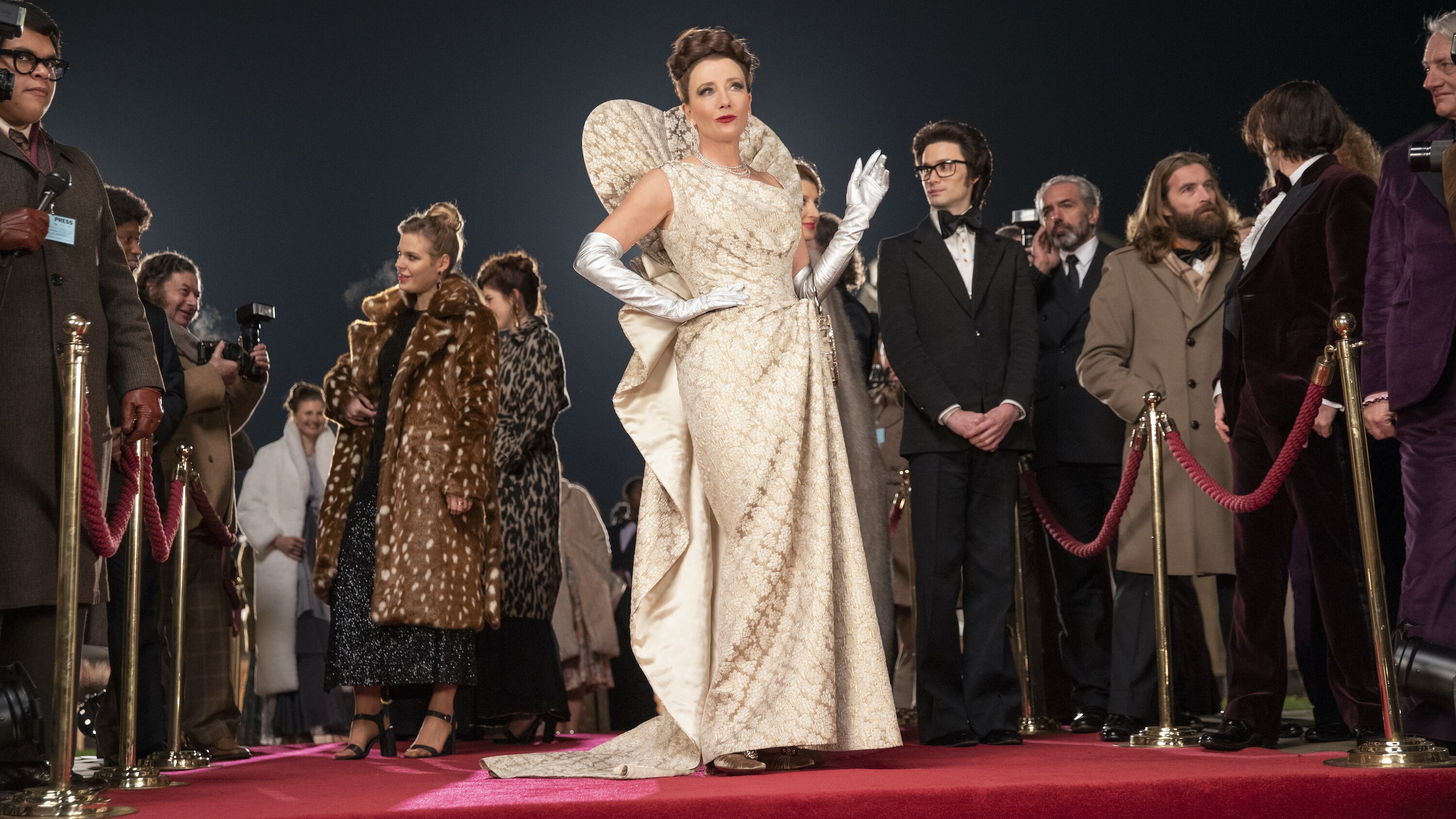 Emma Thompson as the Baroness and Andrew Leung as Jeffrey in Disney’s live-action CRUELLA. Photo by Laurie Sparham. © 2021 Disney Enterprises, Inc. All Rights Reserved.