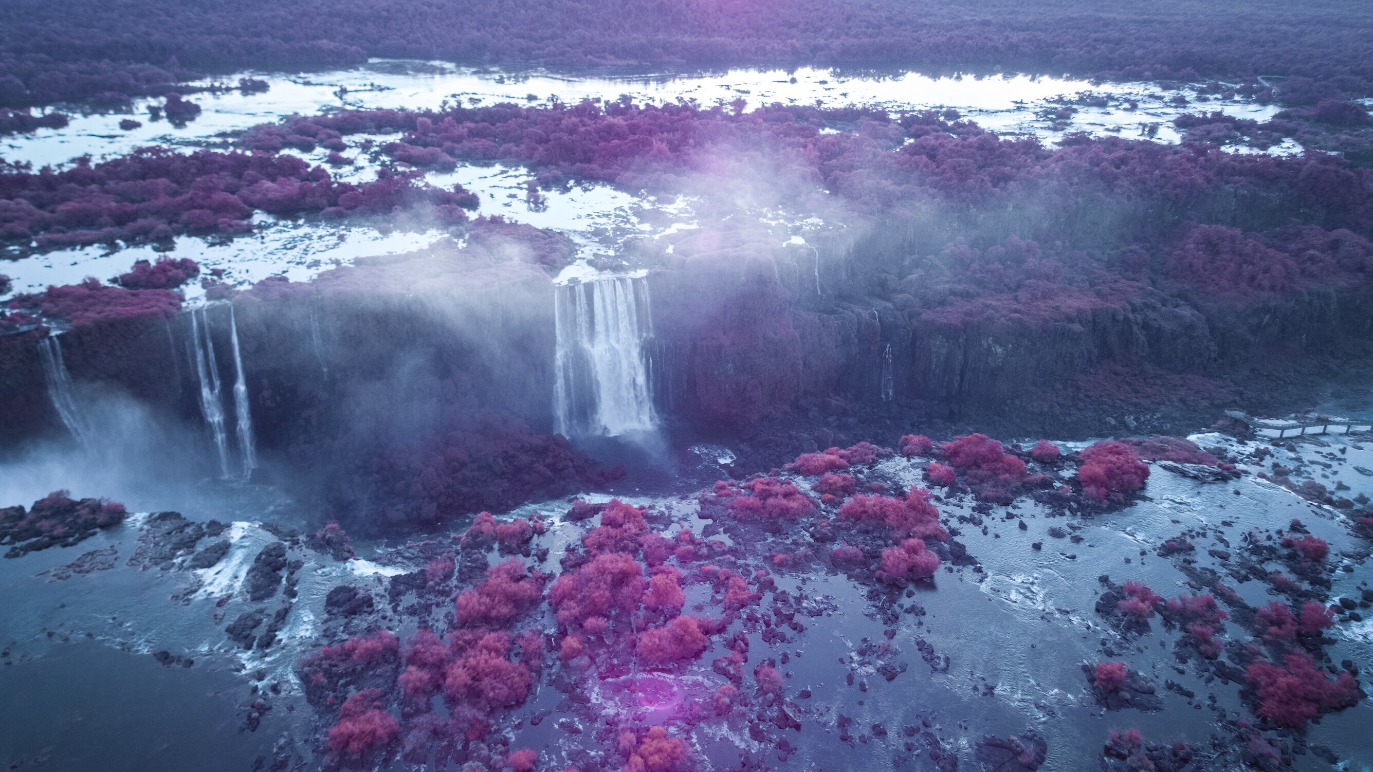 The Iguaçu Falls photographed with an infrared filter, revealing 'color' that is invisible to us.  (National Geographic/Freddie Claire)