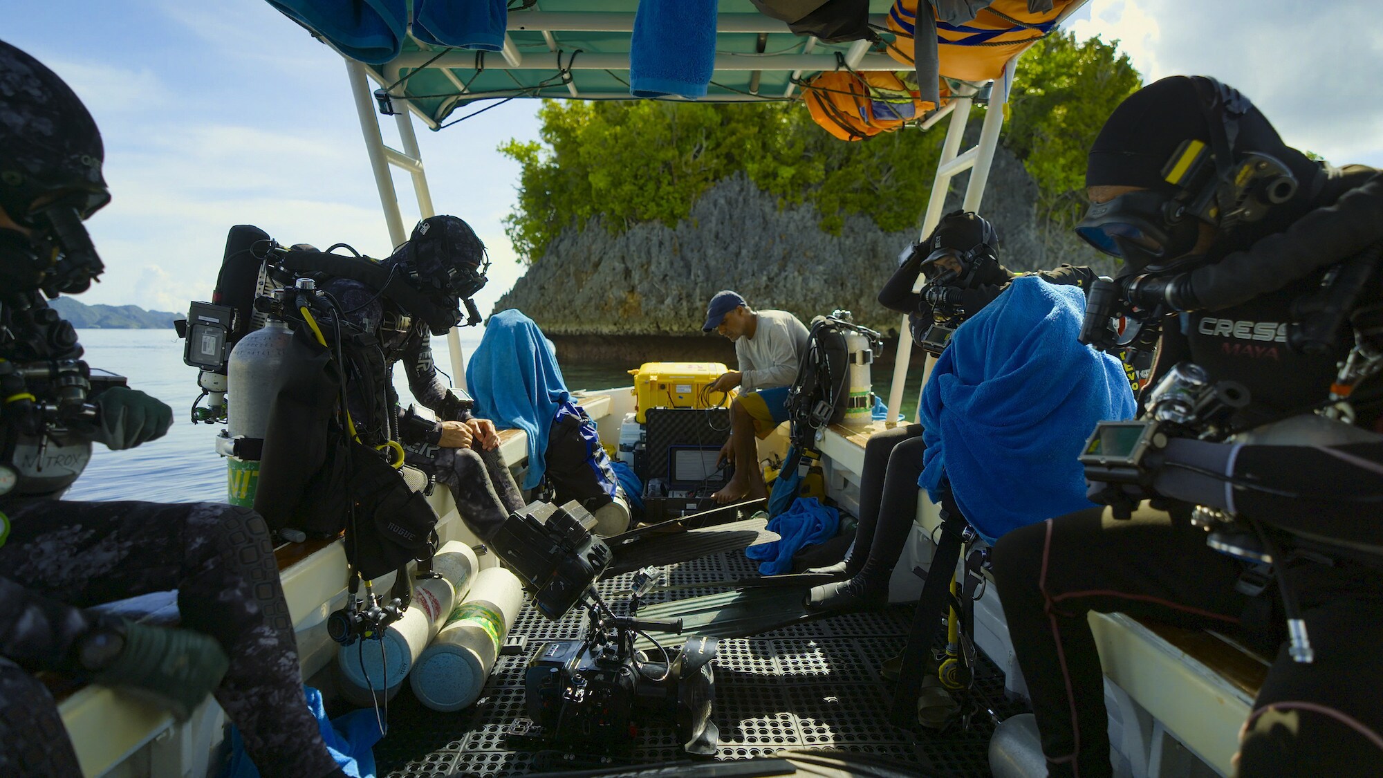 (The crew getting ready to dive on board the dive boat.  National Geographic for Disney+/Spencer Millsap)