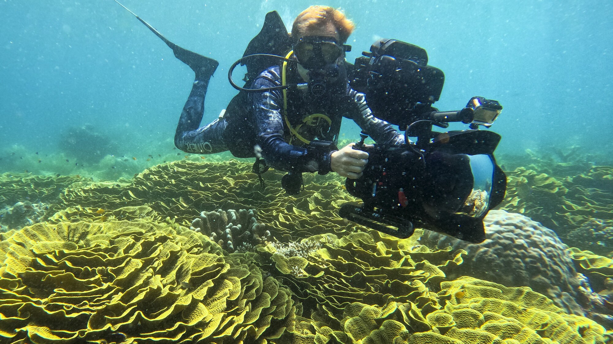 Bertie Gregory filming the coral. (National Geographic for Disney+/Anna Dimitriadis)