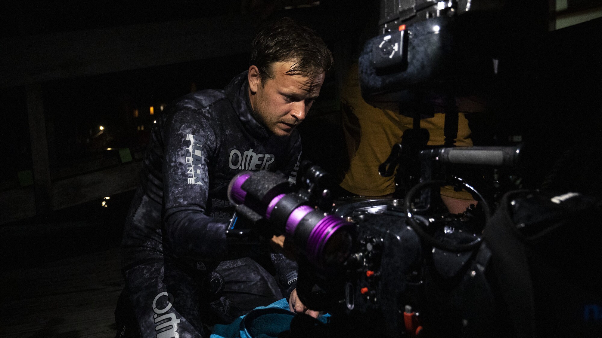 Bertie Gregory with his kit at night. (National Geographic for Disney+/Anna Dimitriadis)