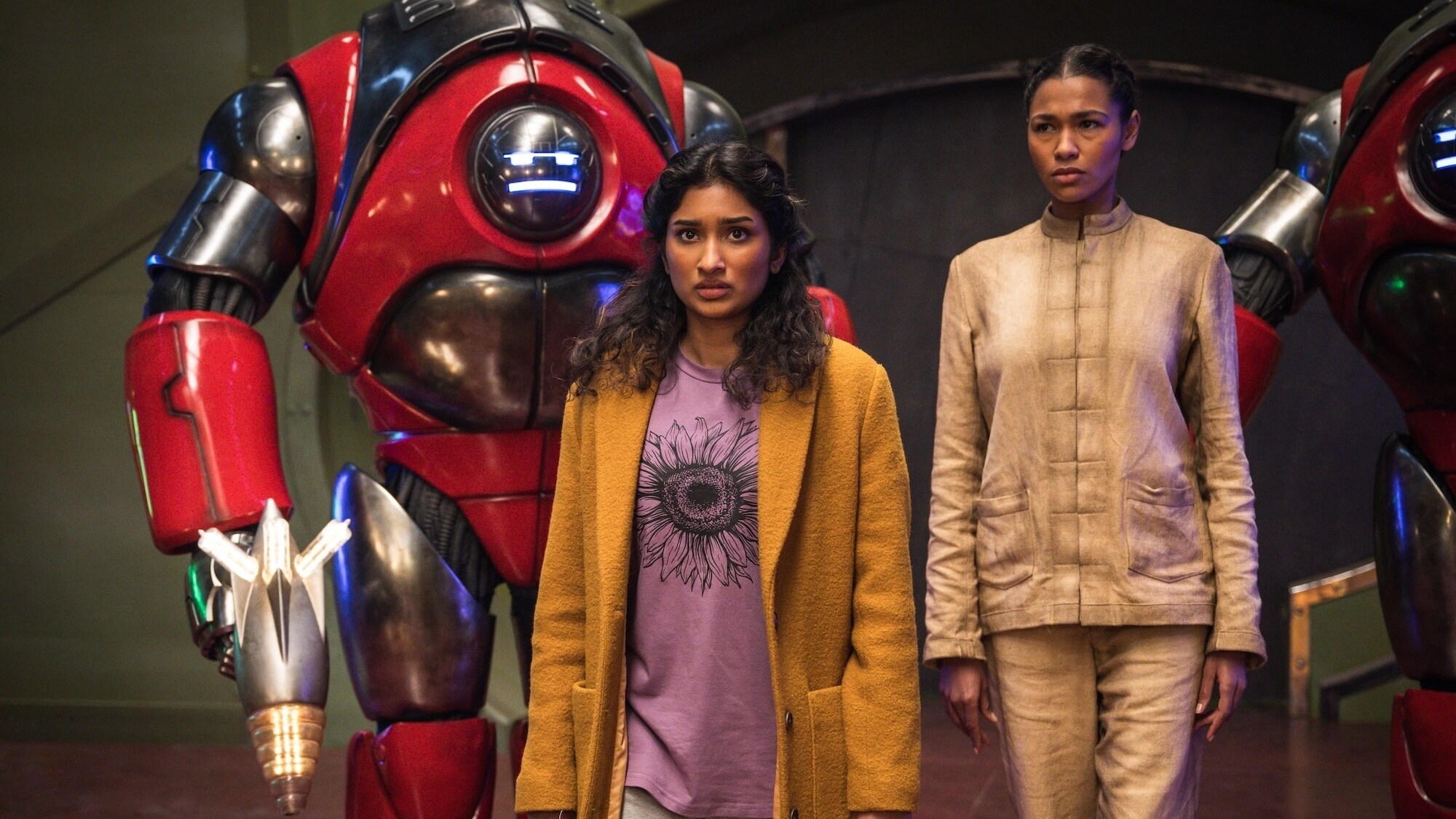 Picture Shows: Robot and Belinda Chandra (Varada Sethu) Sasha (Evelyn Miller) CREDIT: Lara Cornell/BBC Studios/Disney/Bad Wolf