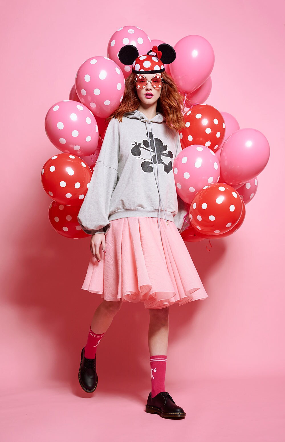 Model wearing products from the limited edition Disney x Karen Walker collection