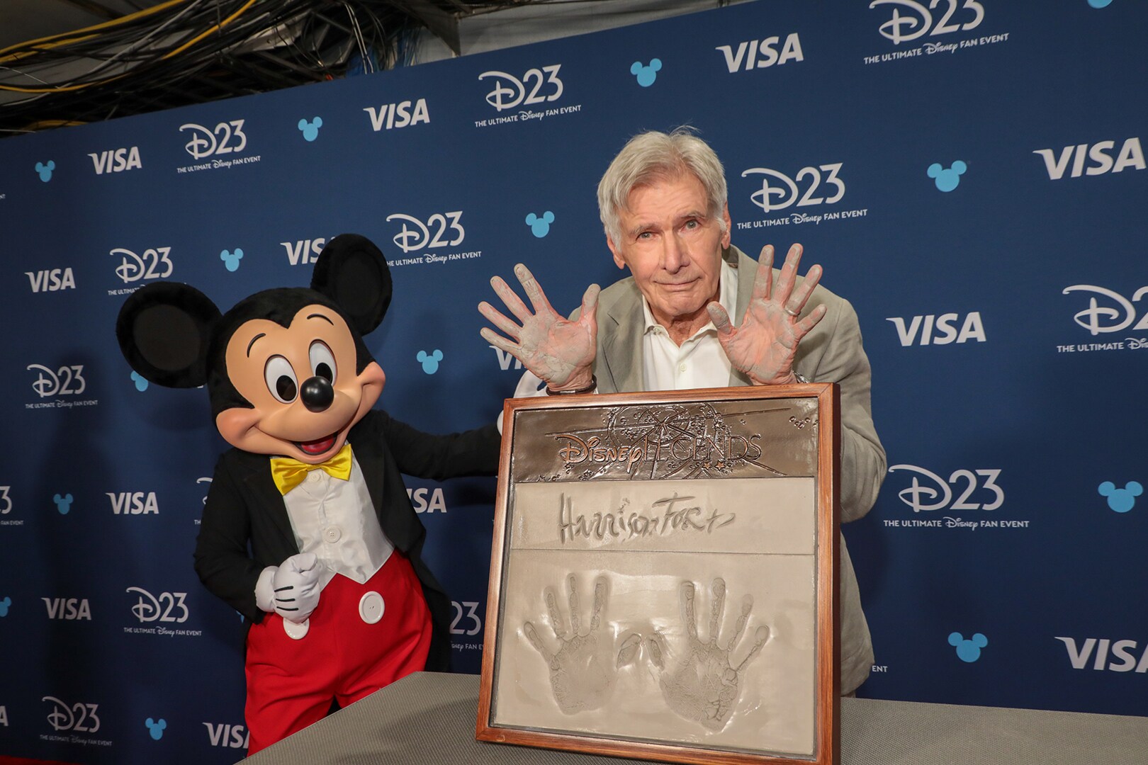 Harrison Ford poses with Mickey Mouse