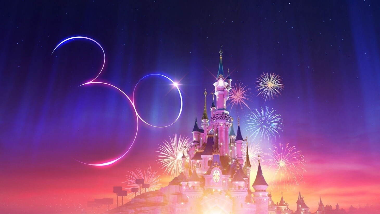 Sleeping Beauty castle at Disneyland Paris with a 30-shaped Mickey head in the sky