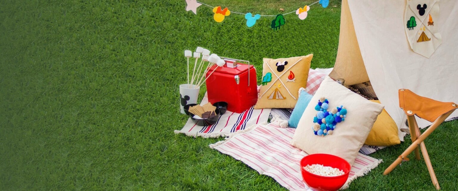 A Mickey inspired tent with cushions and snacks.