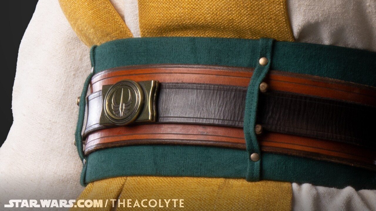 The green sash beneath Jecki’s belt is made from wool felt.