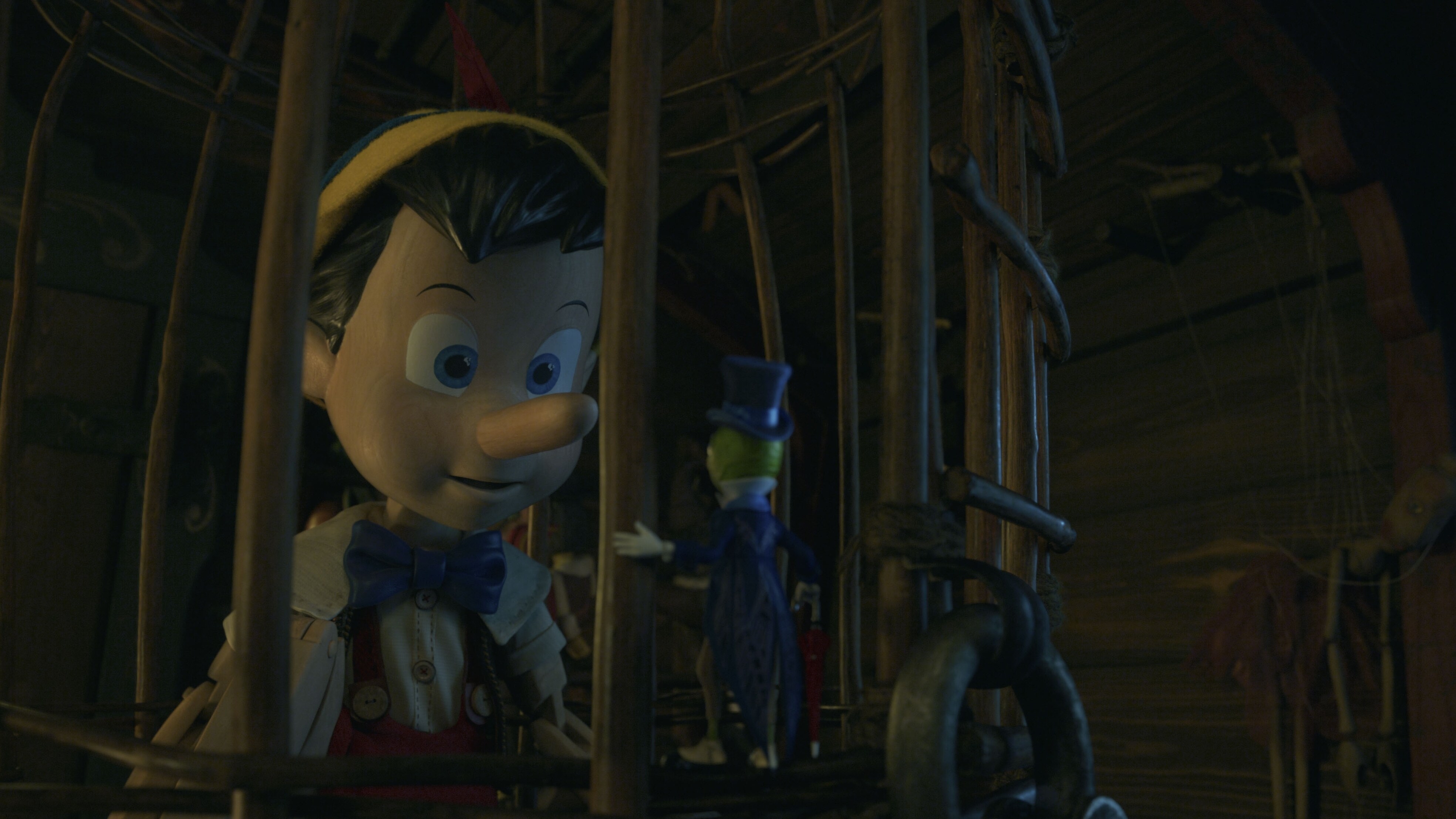 (L-R): Pinocchio (voiced by Benjamin Evan Ainsworth) and Jiminy Cricket (voiced by Joseph Gordon-Levitt) in Disney's live-action PINOCCHIO, exclusively on Disney+. Photo courtesy of Disney Enterprises, Inc. © 2022 Disney Enterprises, Inc. All Rights Reserved.