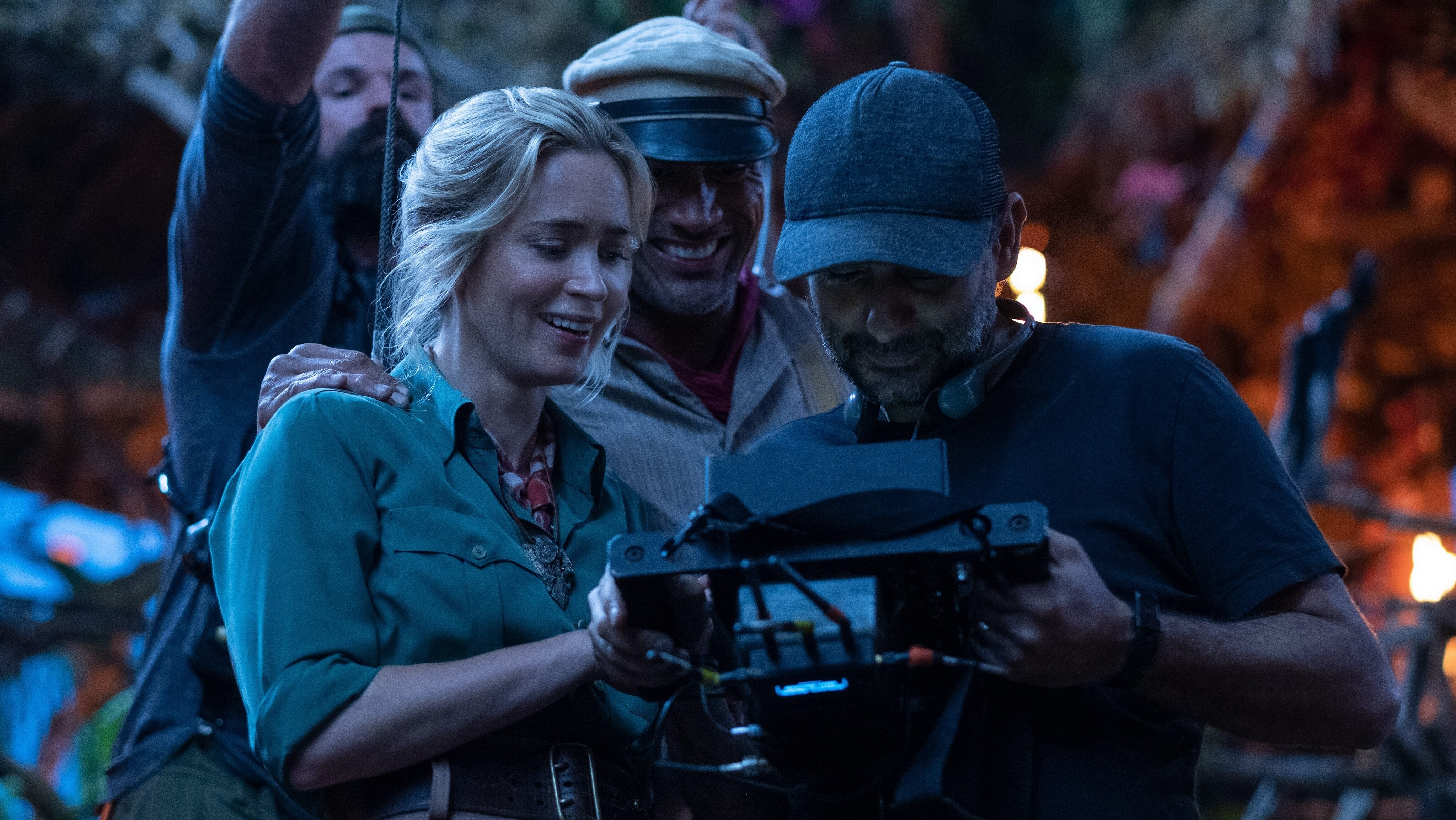 (L-R): Emily Blunt, Dwayne Johnson and director Jaume Collet-Serra on the set of Disney’s JUNGLE CRUISE. Photo by Frank Masi. © 2021 Disney Enterprises, Inc. All Rights Reserved.