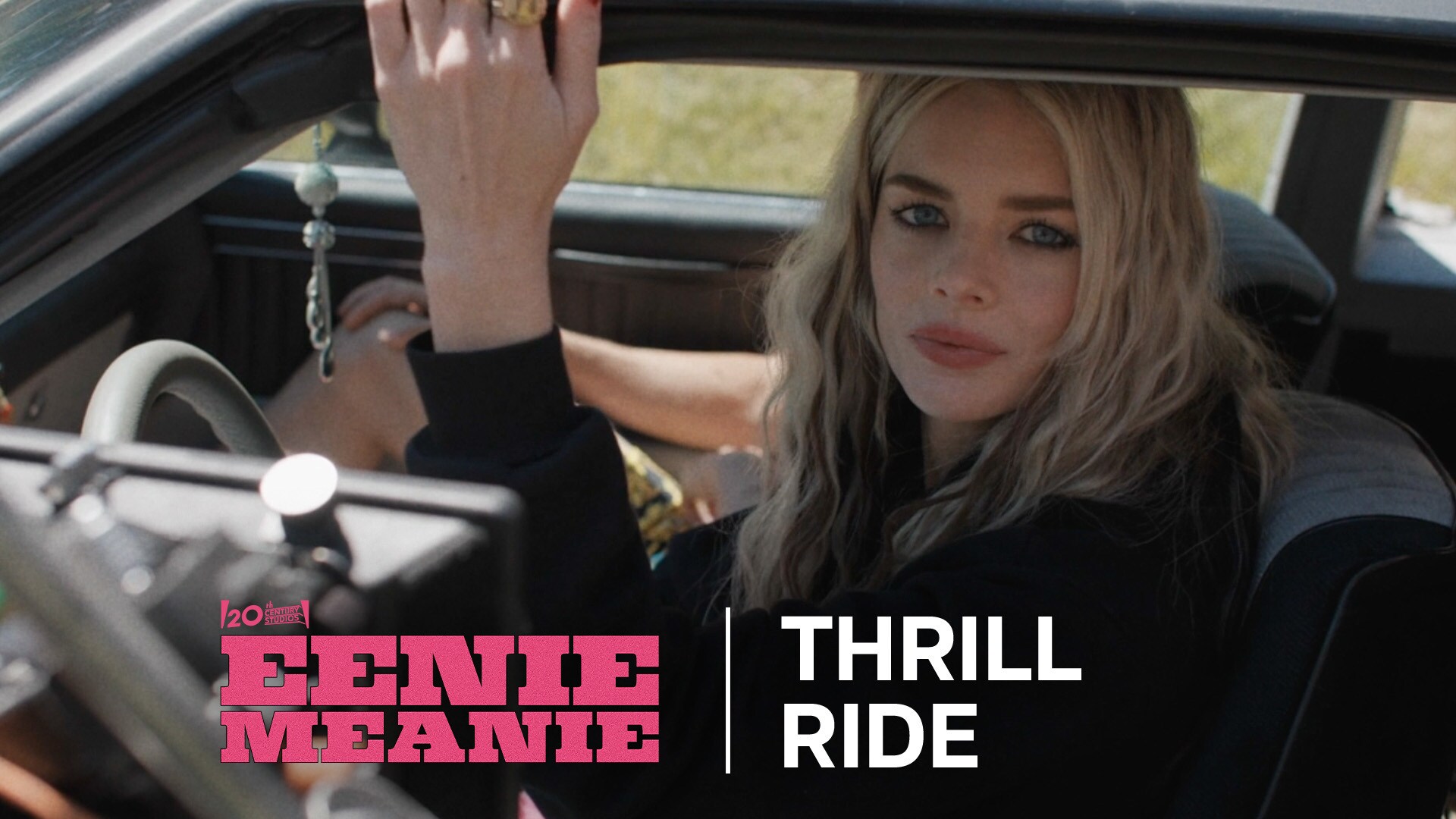 Image of Edie (actor Samara Weaving) looking out from a vehicle window from the Hulu movie, "Eenie Meanie."