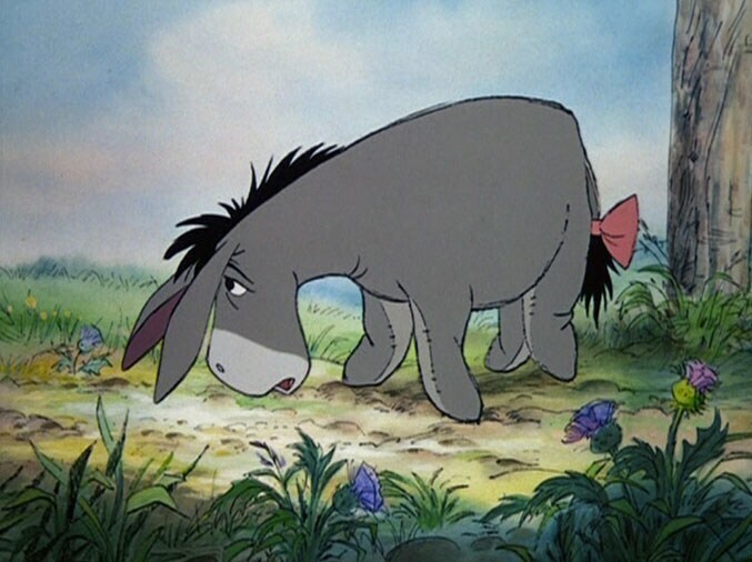 A sad Eeyore with a bow on his tail.
