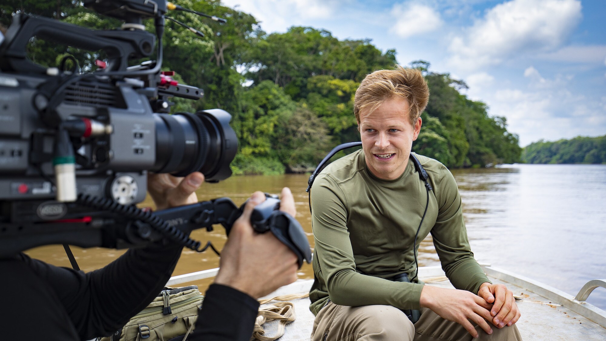 Bertie Gregory doing a piece to camera on the boat on the way to Dzanga Bai. (National Geographic for Disney+/Anna Dimitriadis)