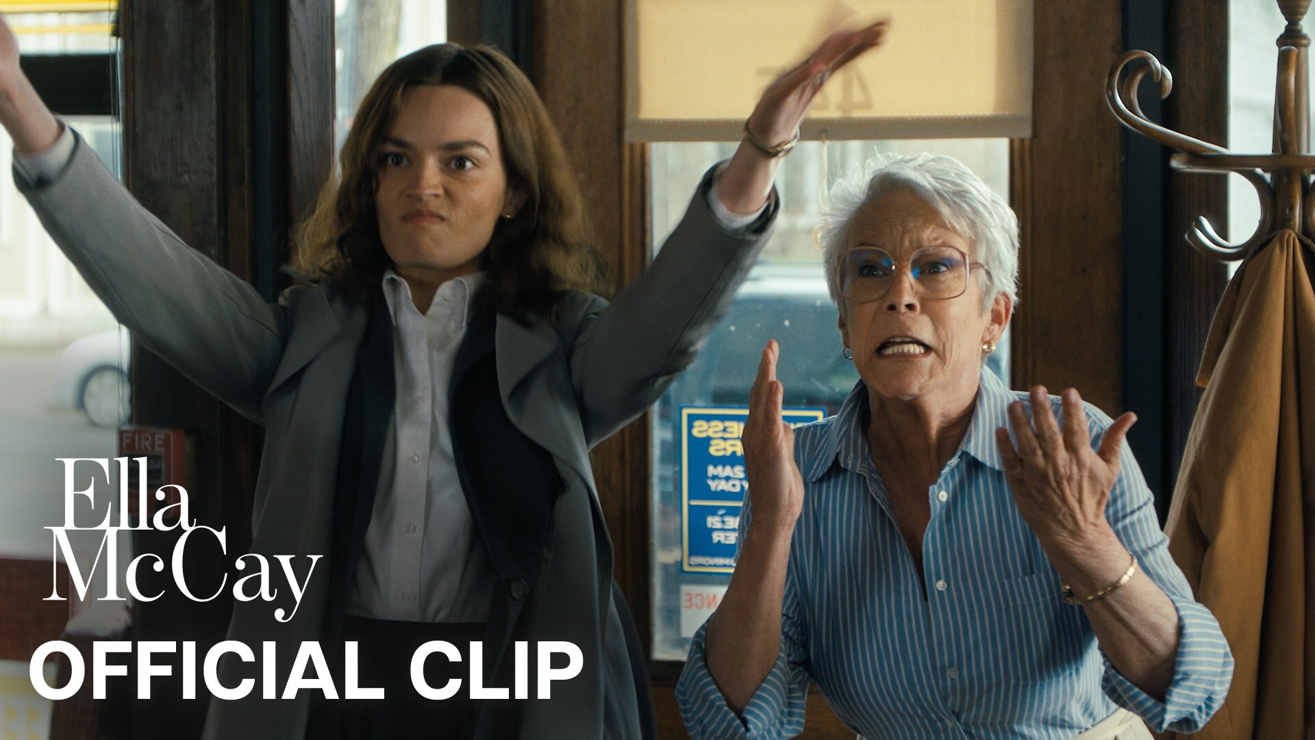 Still image of Emma Mackey as Ella McCay with a look of determination with her hands raised and Jamie Lee Curtis as Helen with a look of anticipation while holding her hands up to her shoulders. | Ella McCay | Official clip