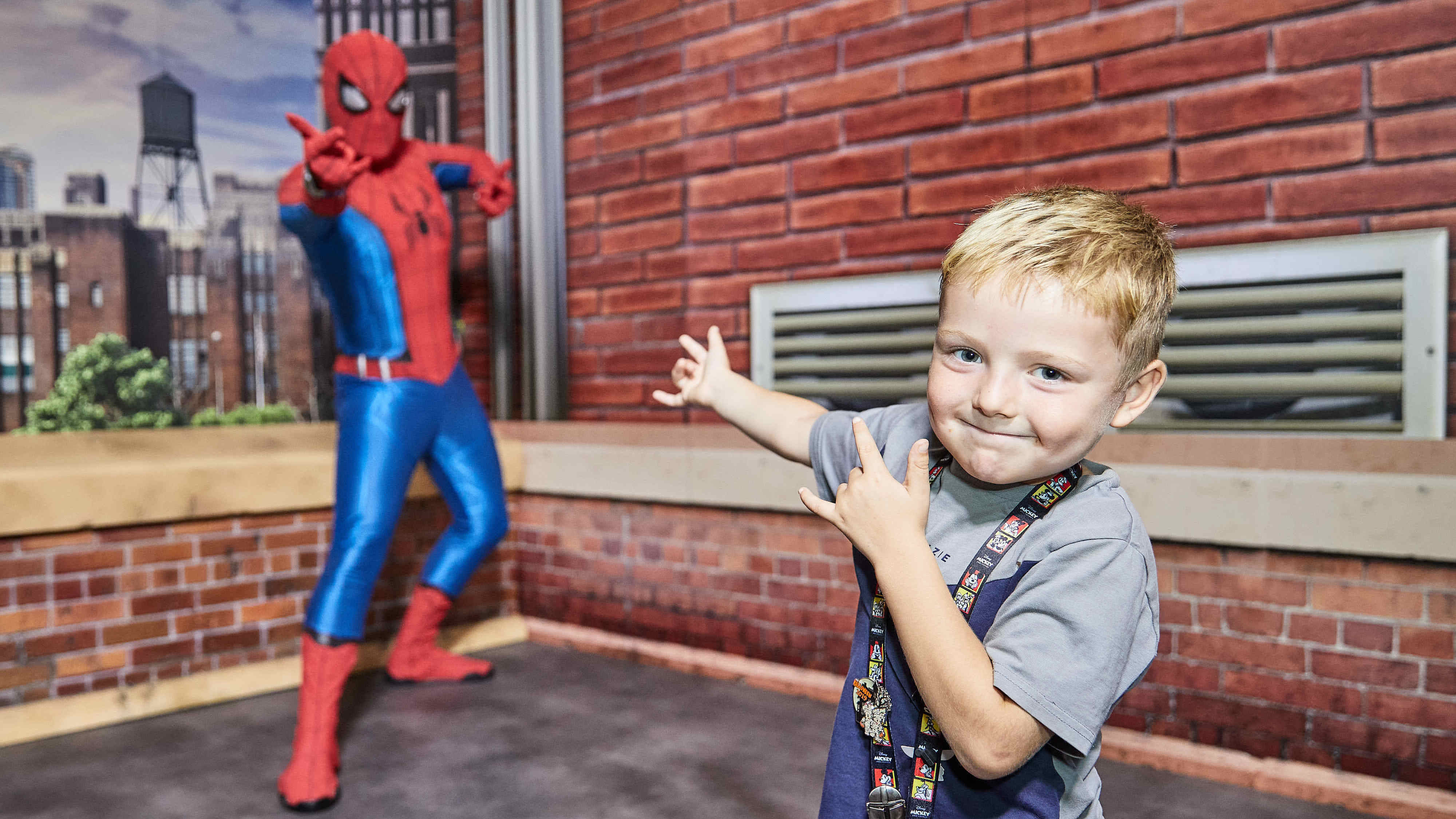 Boy posing with Spiderman