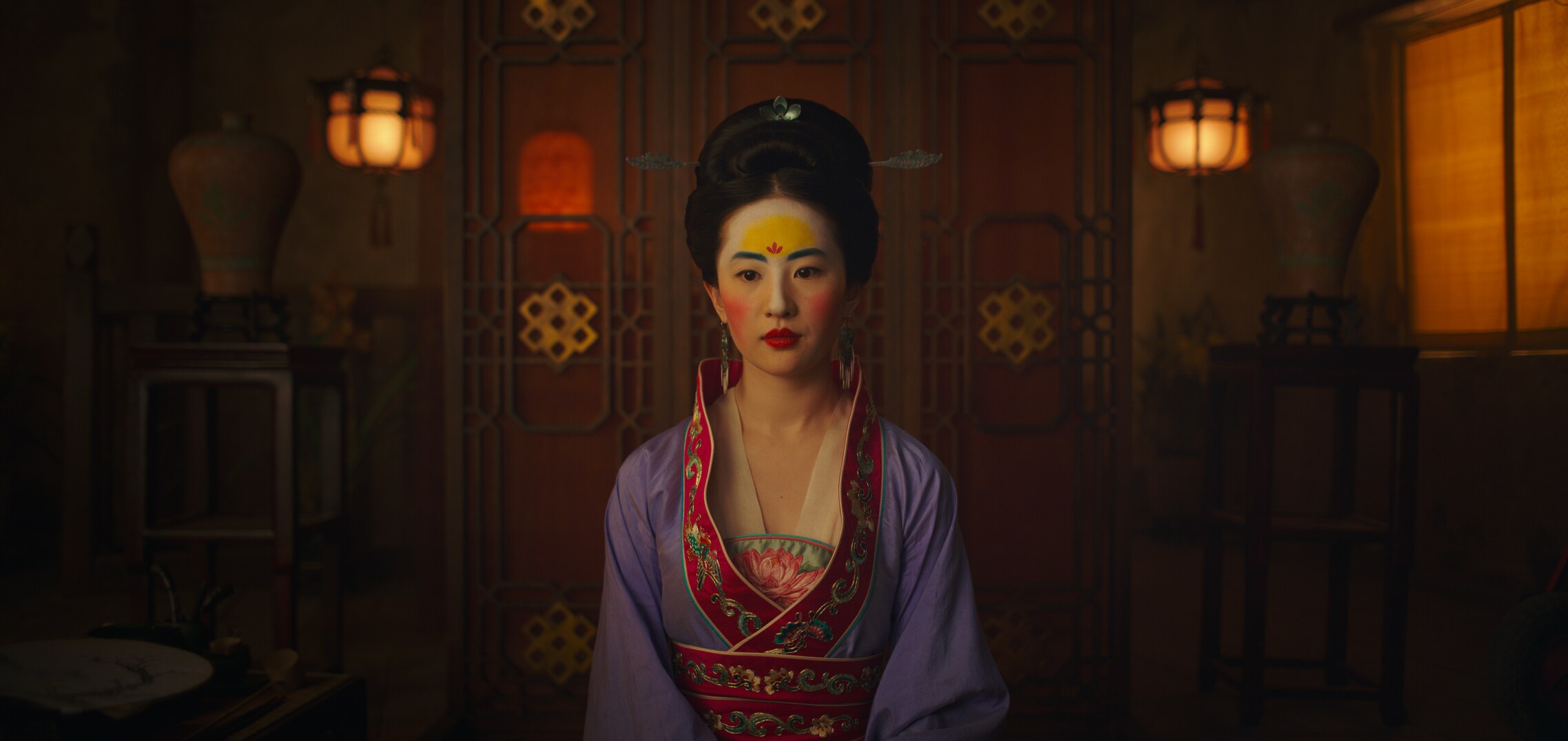 Mulan in make-up and a dress