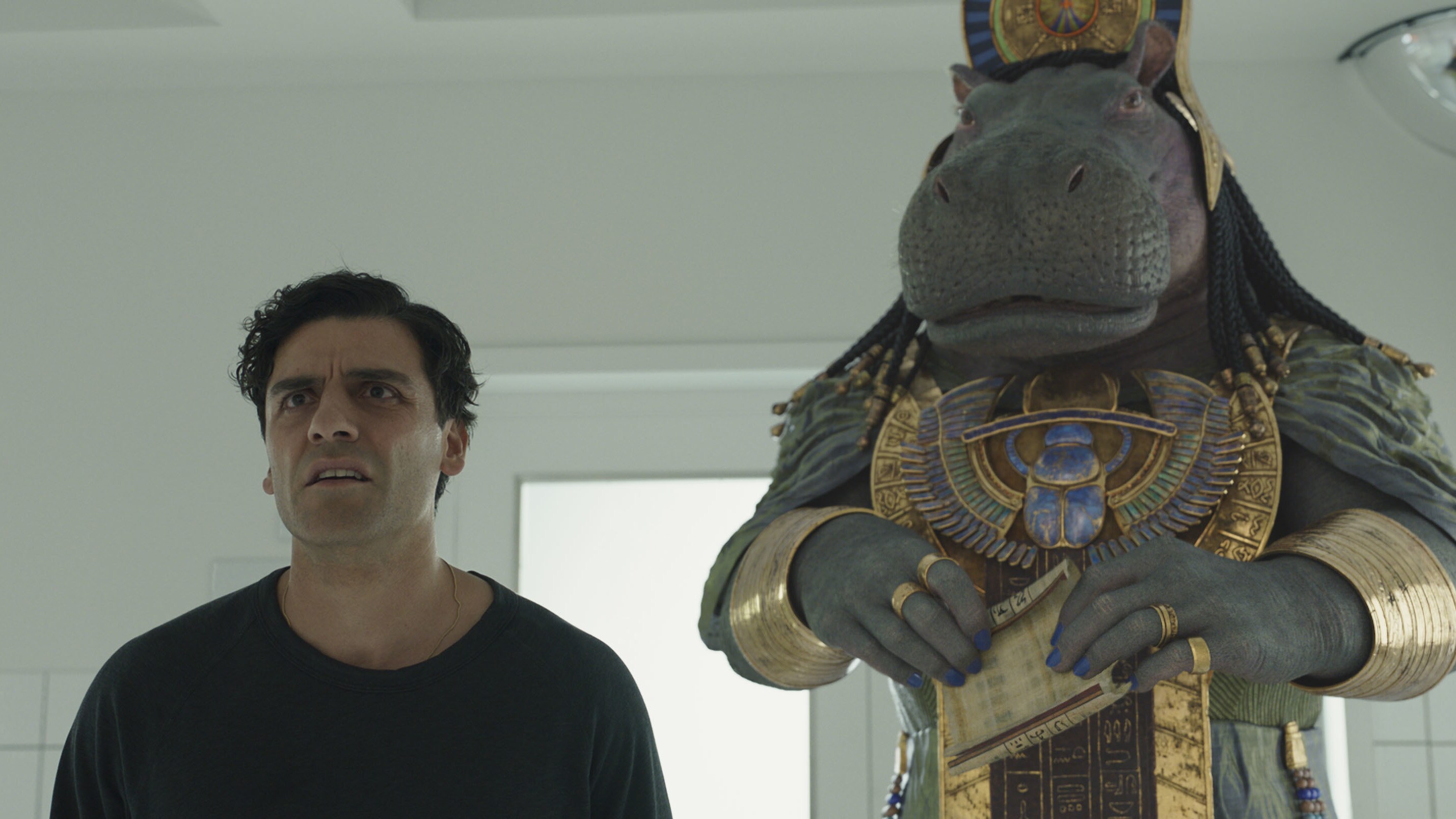 (L-R): Oscar Isaac as Steven Grant and Taweret (voiced by Antonia Salib) in Marvel Studios' MOON KNIGHT, exclusively on Disney+. Photo courtesy of Marvel Studios. ©Marvel Studios 2022. All Rights Reserved. 