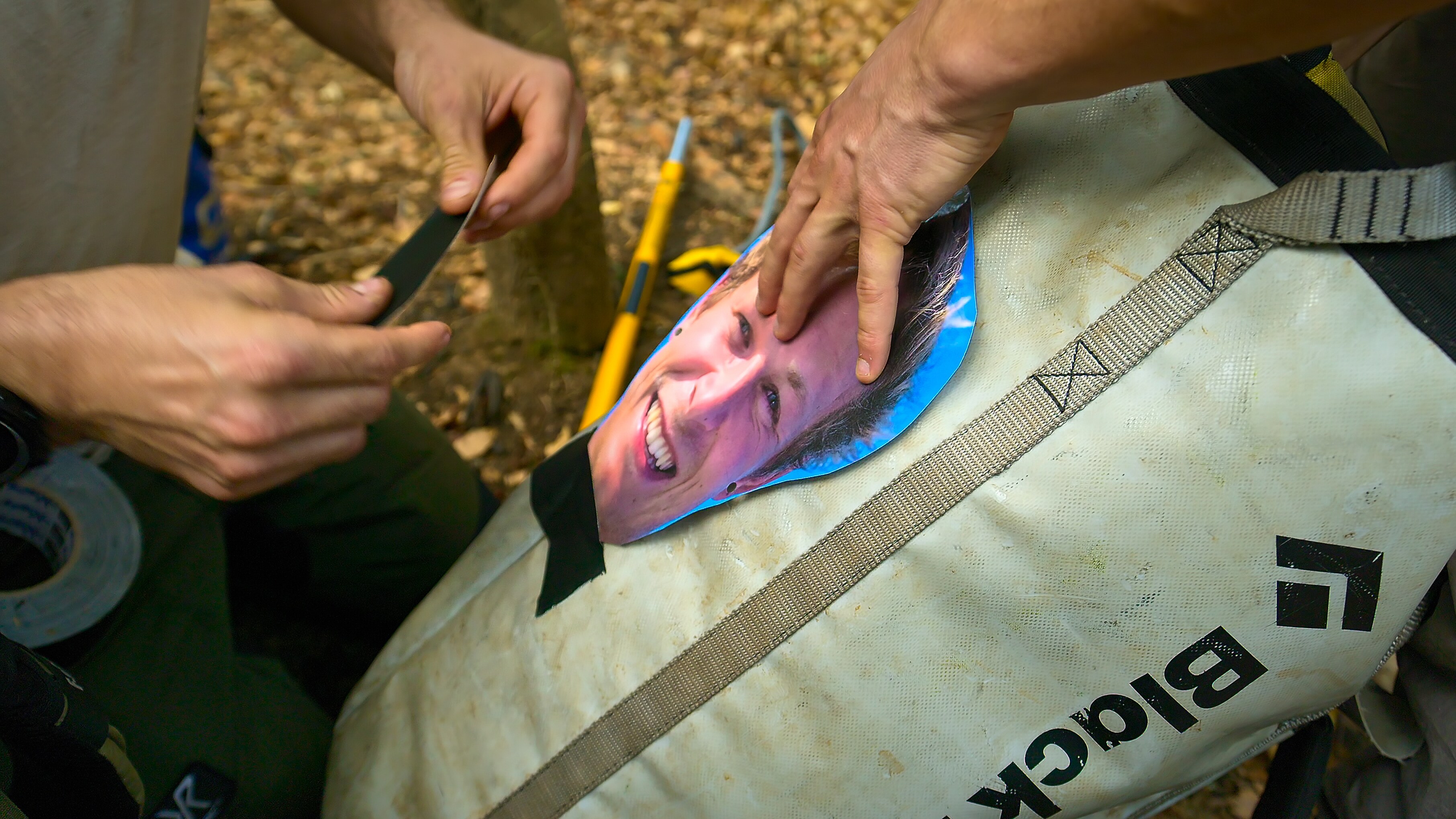 Because eagles attack using the element of surprise. The team take extra precaution by placing a picture of Berties face on the back of their backpack. (Credit: National Geographic/Parker Brown for Disney+)